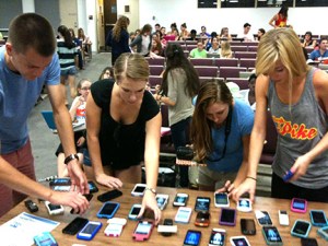 students using cellphones to record interview