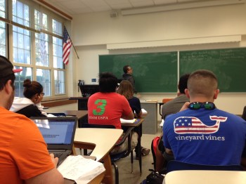 teacher at chalkboard