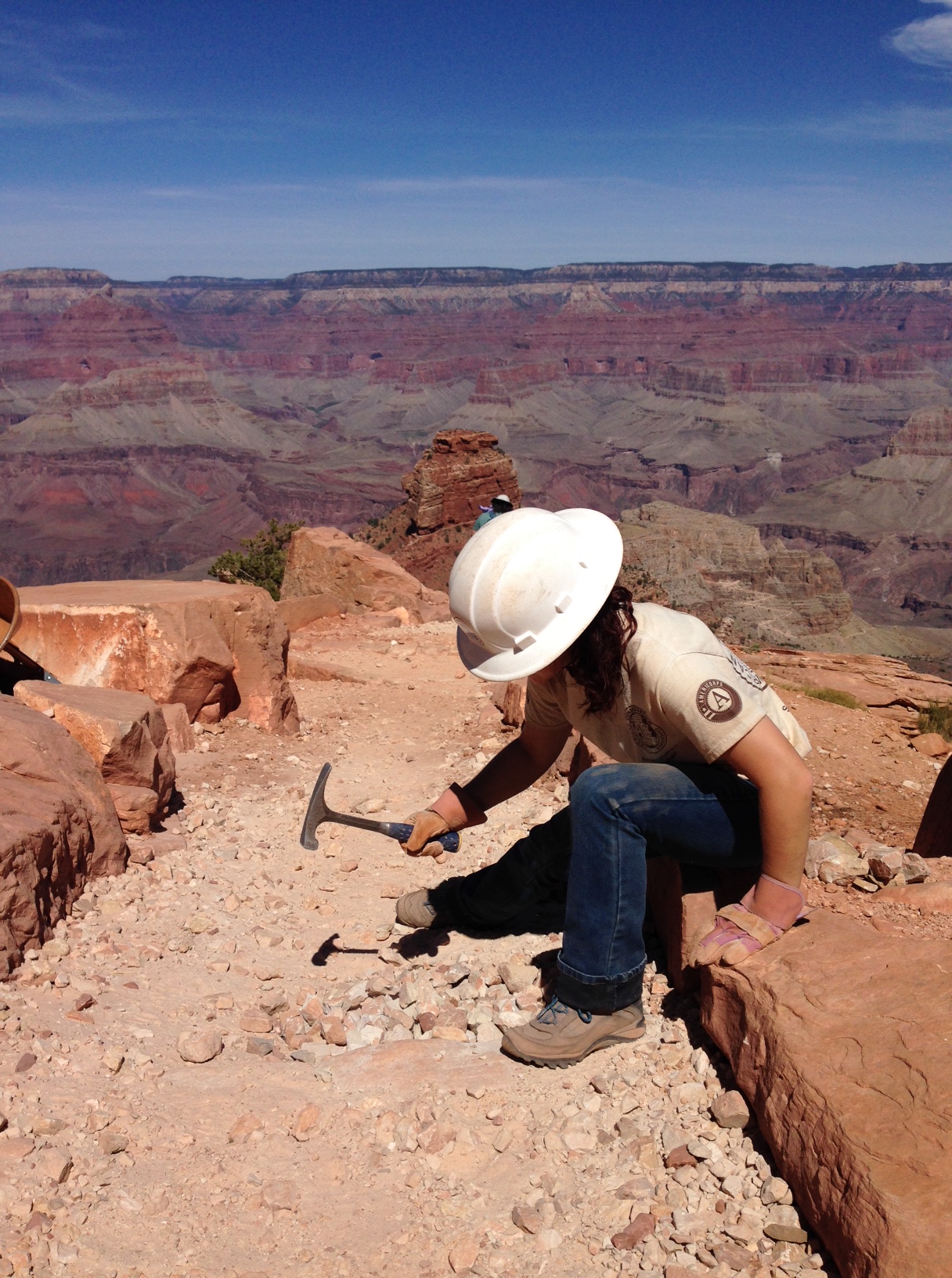 ACE worker breaks up rocks for South Kaibab Trail