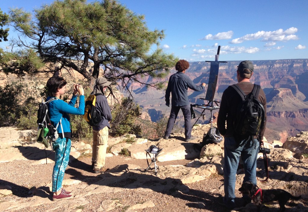 Plein air artist painting on rim of Grand Canyon